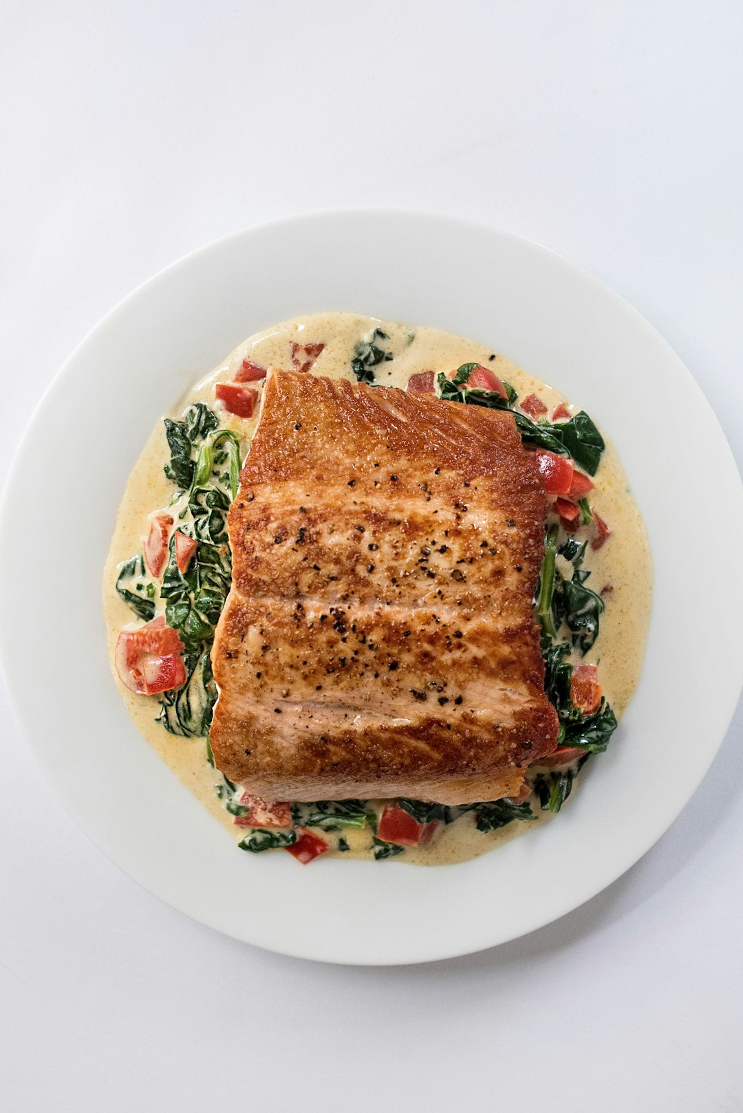 Mediterranean salmon dinner with vegetables on a sheet pan